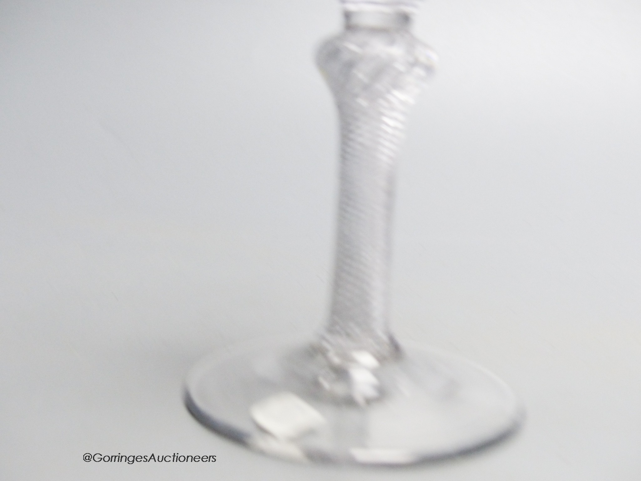 A Georgian air twist stem wine glass c.1750, a bell shaped bowl. 17cm